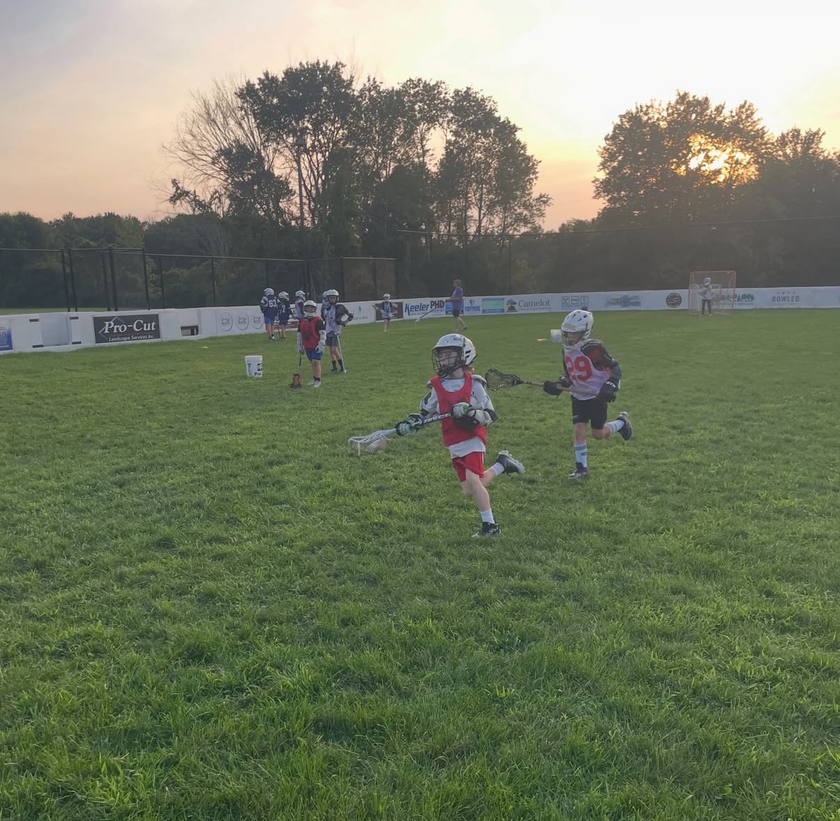 Players competing in a drill at Trust Lacrosse summer camp