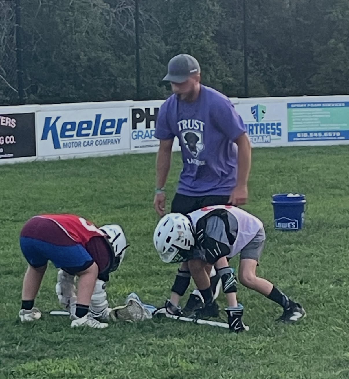 Faceoff instruction during Trust Lacrosse summer camp